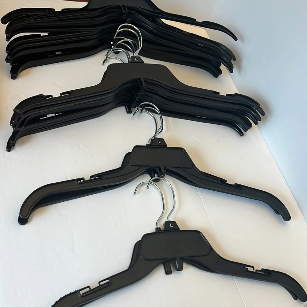 24 Black Retail Hangers with Silver Hook and All Can Add Another Hanger.